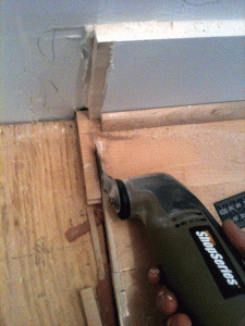 Oscillating tool comes in handy to finish up cutting the floor boards. 