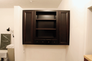 Open center cabinet for knick knacks or whatnot.  Spice drawers for charging cords and whatnot.