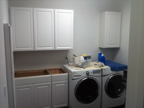 Laundry room cabinets are installed.