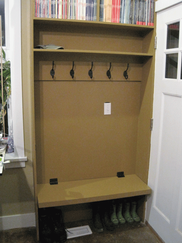 Image of the finished studio entrance bench and coat hooks.