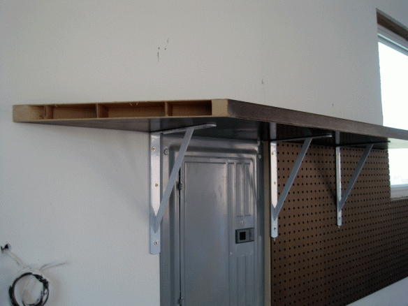 Here you can see the 45 degree angle I cut on the end of the hollow bi-fold door that is now my garage shelf.