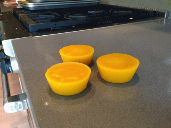 Bees wax "muffins" ready for storage or use.