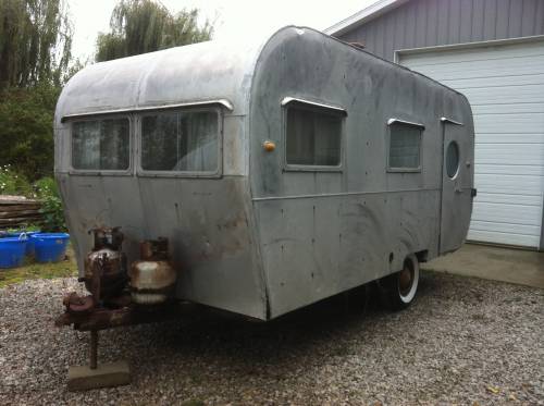 This two door 1953 canned ham style trailer would be perfect. I love the port hole window in the door. Asking price is right in our budget at $1,600